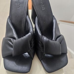 Elegant Black Leather Mules with Bow Accent